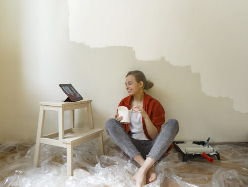 Woman eating on a break from decorating new home